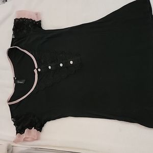 Black Medium shirt with pick accents and some ruffling. Very good used condition